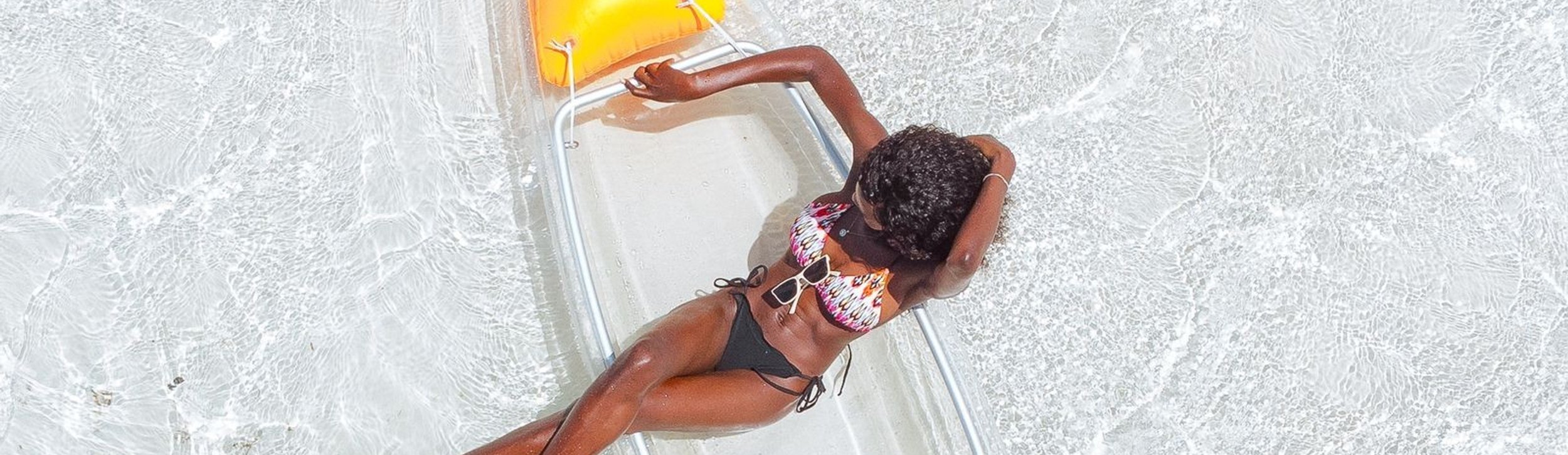 a group of people standing in front of a board